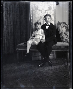 Two boys, seated