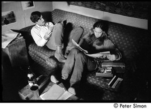 Elliot Blinder and Ellen Weiss, sitting on a sofa, reading, Packer Corners commune