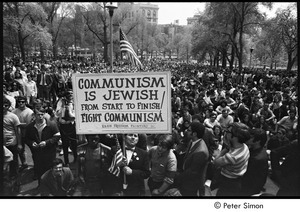 Kent State Shooting Demonstration at the Boston State House: protestors gathered on Boston Common, counter-protestor in middle holding a picket sign