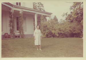 Shirley Graham Du Bois on lawn of unidentified home