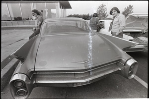 Antiwar demonstration at Fort Dix, N.J.: young men standing by 1960 Cadillac Eldorado (tail fins)