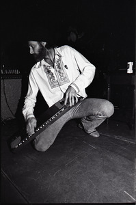 Beach Boys at Boston College: Mike Love kneeling with keyboard