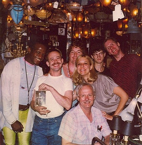 A Photograph of Marsha P. Johnson Posing with a Group at Uplift Lighting