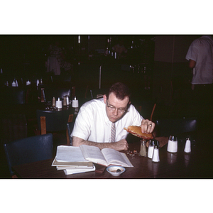 Student studying while eating