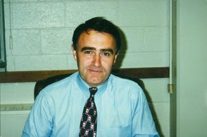 Suffolk University Professor and Dean (1998-1999) William T. Corbett (Law) seated in chair