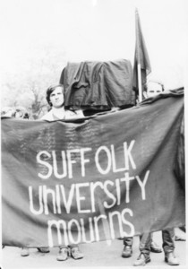 Suffolk students holding banner "Suffolk University Mourns" and coffin during at student protest of the Vietnam War, 1969