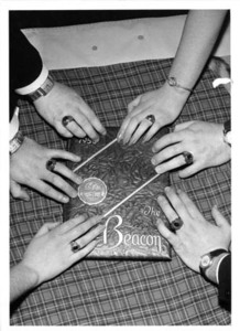 Suffolk University students showing off their class rings for the Beacon yearbook, 1955