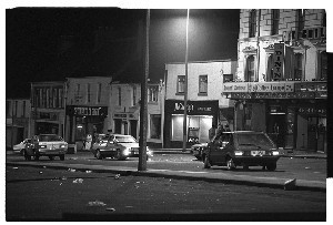 Scene at Oak Grill Restaurant shooting, Castlewellan, Co. Down, when an off-duty RUC member went berserk and fired shots through the window of this restaurant. Photographs of his abandoned car and of the scene at night