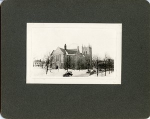 Bapst Library exterior: main entrance in winter with cars, by Clifton Church