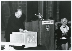 Robsham Theatre exterior: dedication, Joseph M. Larkin placing documents in time capsule for cornerstone while Mary B. Muse looks on