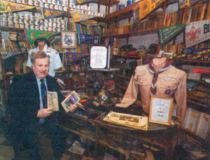 Scoutmaster Ron Fuller with Boy Scout memorabilia