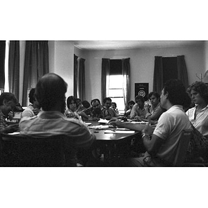 Jorge Hernandez (front left, with the back of his head to the camera) and other Inquilinos Boricuas en Acción staff at a meeting.