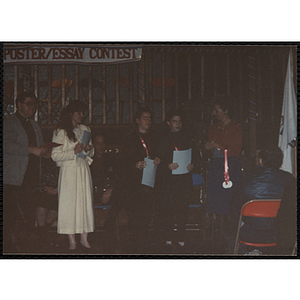 Two girls stand side by side, holding their awards from the MADD 1991 Poster and Essay Contest