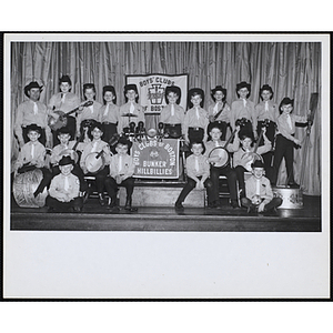 The Bunker Hillbillies pose with their instruments on a stage