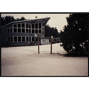 A shot of the Nashoba Valley Ski School sign and lodge