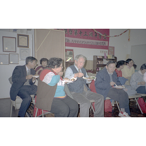 Guests talking during a Chinese Progressive Association anniversary event