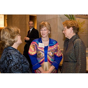 Deanna Jantzen converses with two women at the inauguration celebration of President Aoun