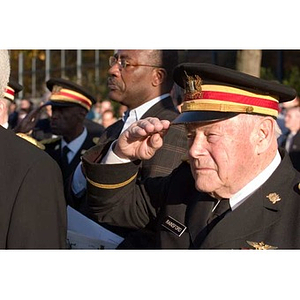 Edmund Rainsford salutes at the Veterans Memorial dedication ceremony