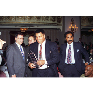 Muhammad Ali with his award at the Center for the Study of Sport in Society's annual banquet