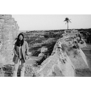 Leslie Foman poses on a half-ruined wall in Israel