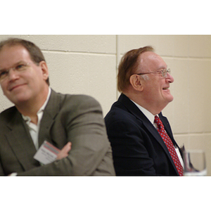 Peter Barrett, PhD '79, left, and Barry Karger, right, at the NU Today Cancer Research Panel