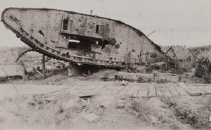 An overturned tank next to a plank road, Menin Road, between Ypres and Menen