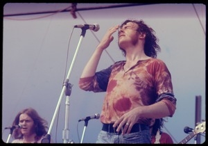 Joe Cocker performing on stage at the Woodstock Festival