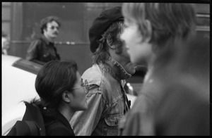 Yoko Ono at a demonstration against the prosecution of Oz Magazine editors on charges of obscenity, begins to march with John Lennon (partl obscured) and others