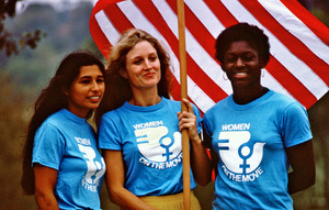 Sylvia Ortiz, Peggy Kokernot and Michele Cearcy with the American flag