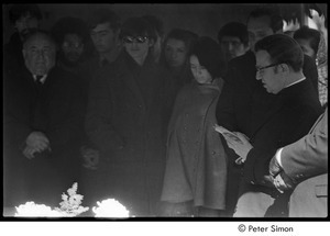 Jack Kerouac's funeral: mourners gathered around casket, Father Armand Morrissette (right)
