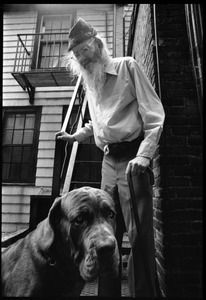 Prescott Townsend with a large dog in a Beacon Hill alley