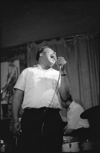 James Cotton at Club 47: James Cotton singing into a microphone onstage with drummer Francis Clay at right