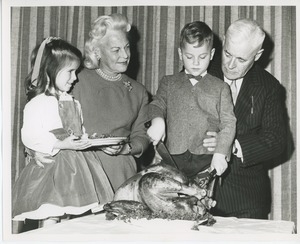 Staff with young clients at Thanksgiving dinner