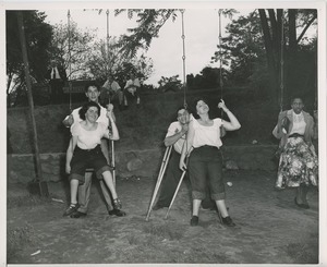 Young women on swings
