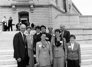 Congressman John W. Olver (left) with group of visitors from Massachusetts corporations, posed on the steps of the United States Capitol building