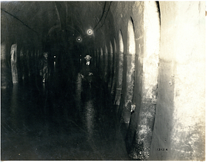 Men in a subway tunnel