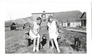 A Photograph of Dorris Bullard and Friends Sitting on a Car