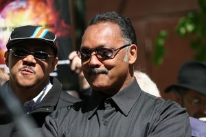 Jesse Jackson listening to speakers during the march opposing the war in Iraq