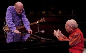 Pete Seeger talking with George Wein (on piano) at the Power of Song Award concert, Symphony Space, New York City