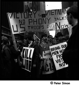 Antiwar demonstrators with banners 'Victory for Vietnam, no phony talks, US troops out now'