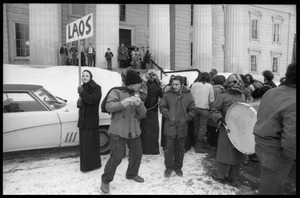 Protesters (including masked members of Bread and Puppet Theater) on the steps of the Vermont State House during a demonstration against the invasion of Laos