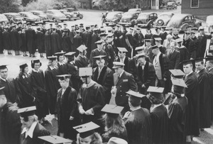 Faculty and dignitaries in commencement procession into Curry Hicks Cage