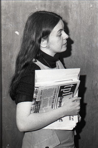 Bernadette Devlin McAliskey at the WBCN studios, holding copy of 'the people first'