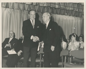 Bob Hope shaking hands with Jeremiah Milbank, Sr.