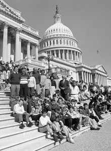Congressman John W. Olver (center) with group of visitors, posed on the steps of the United States Capitol building
