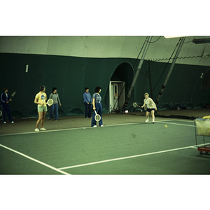 Women practicing tennis