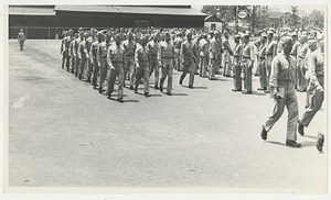 Army Air Corps marching in parking lot (June 1943)