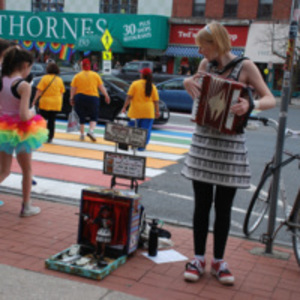 Accordionist at rainbow crosswalk