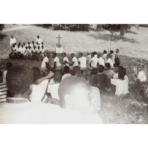A group of campers gather for a religious service at Breezy Meadows Camp