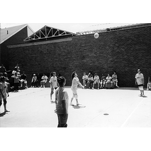 Women playing volleyball.